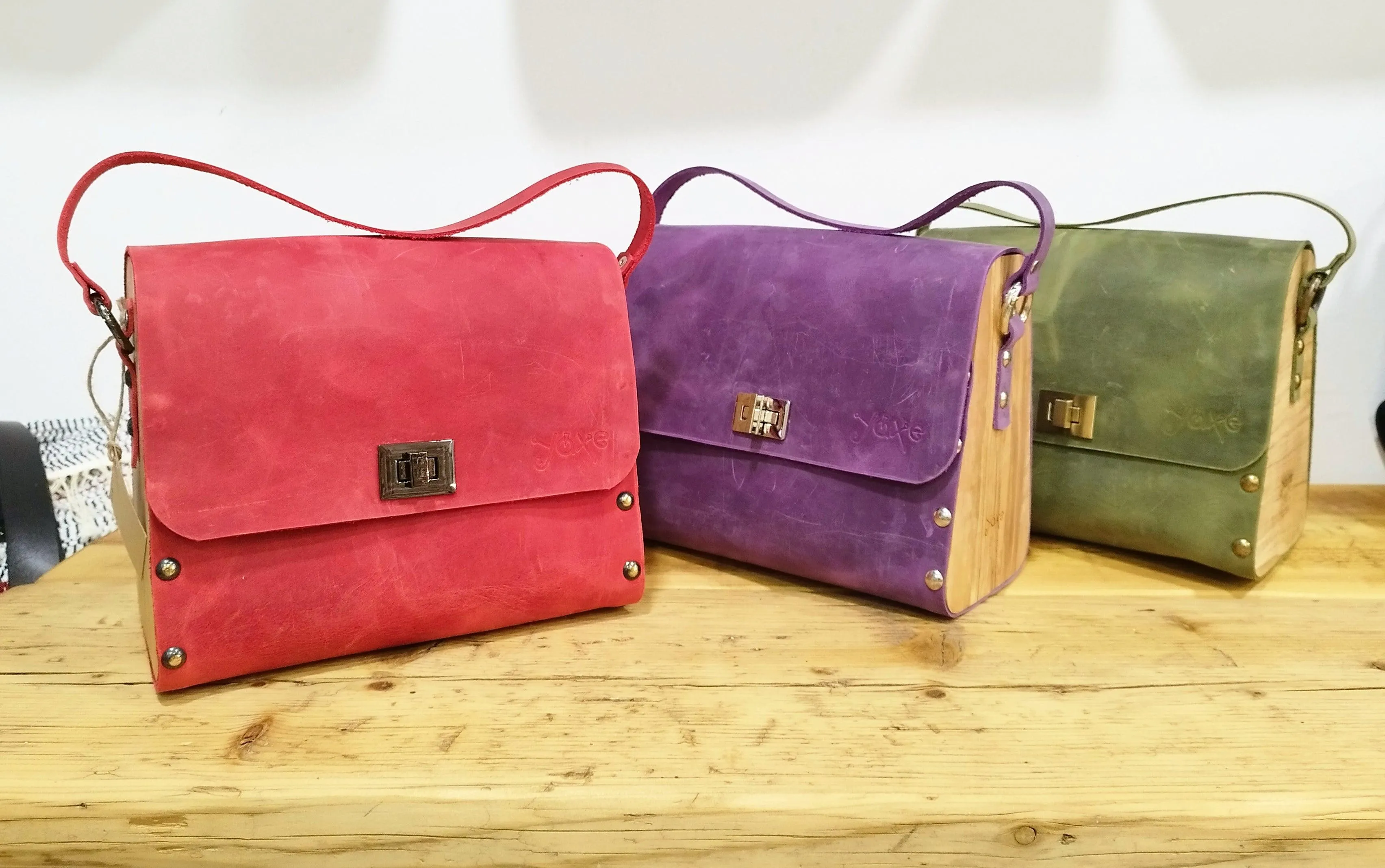 Red oil leather top handle bag and olive treee wood