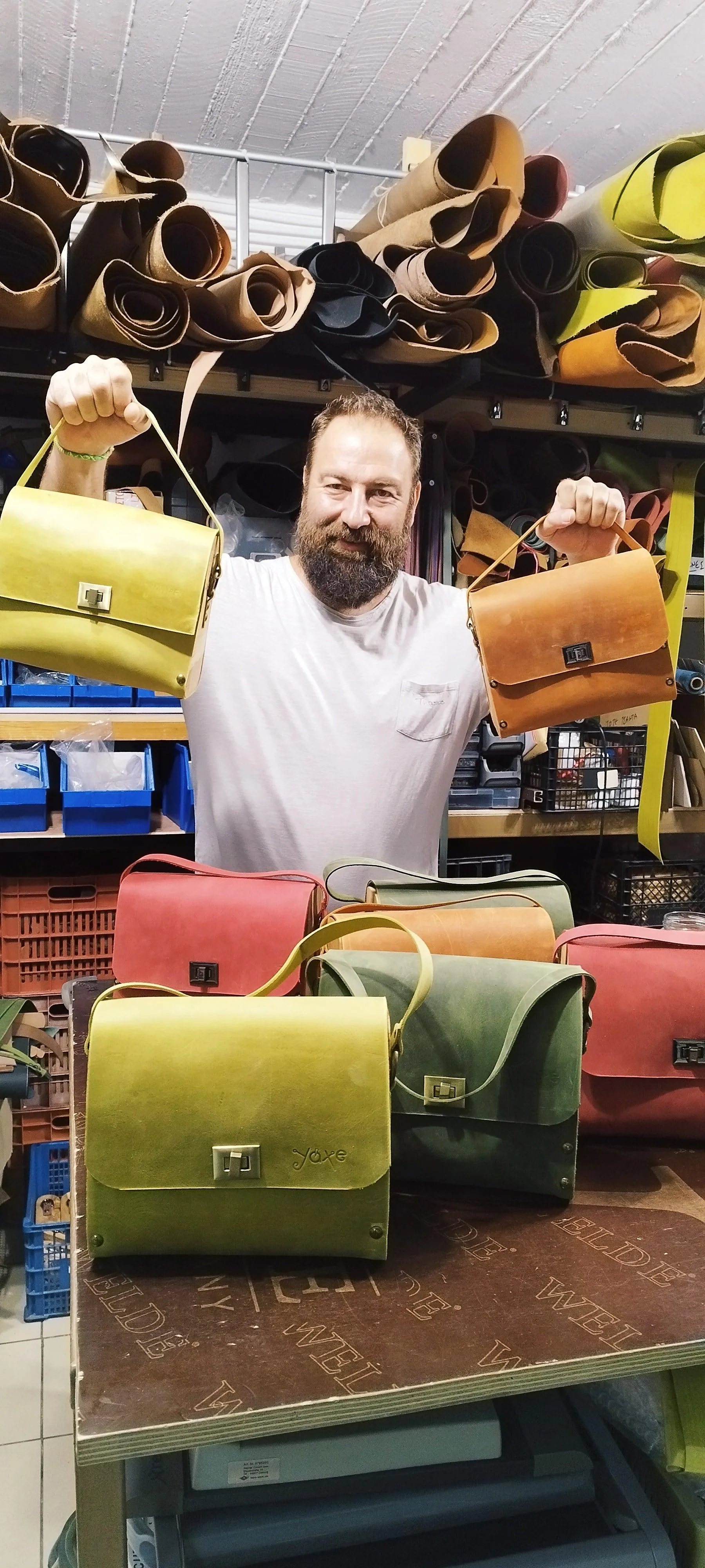 Red oil leather top handle bag and olive treee wood